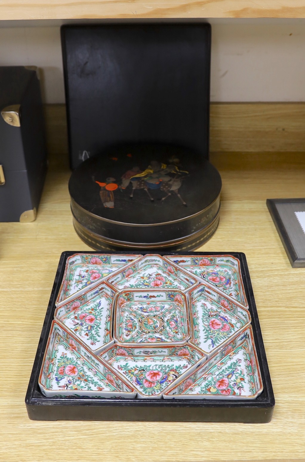 An early 20th century Chinese polychrome lacquer supper set and a Chinese Republic period famille rose boxed slipper (2 sets), slipper box, 31 cms square